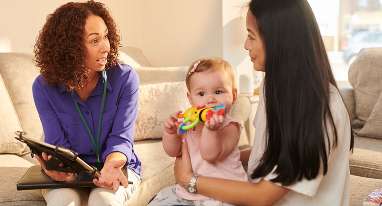 chatting with young mom and baby