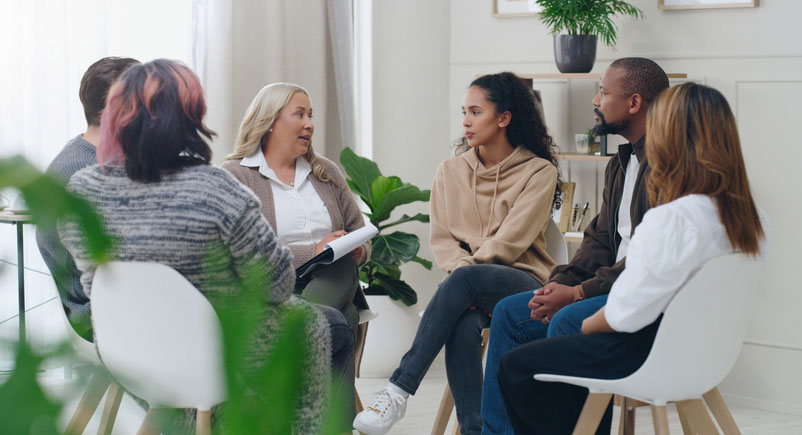 diverse group in mental health therapy session