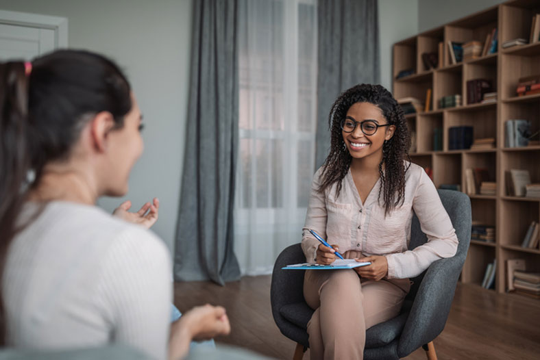 social worker talking with young woman