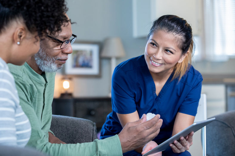 healthcare social worker helping couple