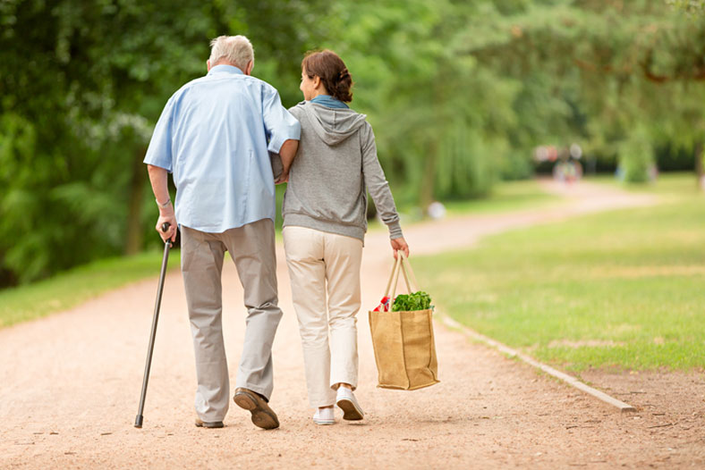 helping elderly with groceries